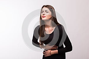 Woman about to chuck, throw up, retch barf, hurl isolated on white background. photo