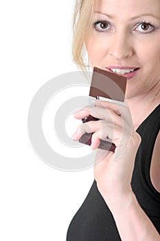 Woman about to eat a chocolate bar