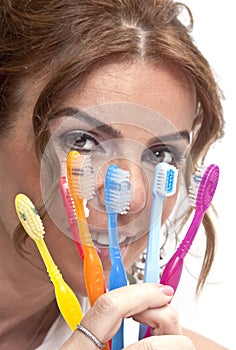 Woman with tooth brushes