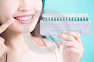 Woman with tooth whiten photo