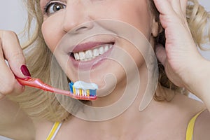 Woman and a toothbrush