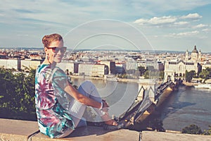 Woman toothy smile at Budapest panorama, Hungary