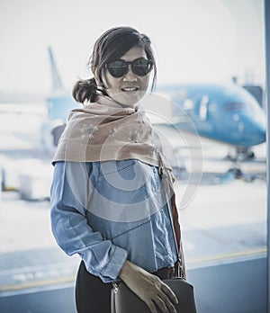 Woman toothy smiling face happiness traveling in airport