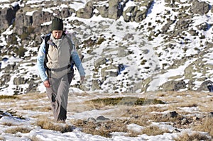 Woman in the top of a in mountain hiking