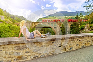 woman on Solis Viaduct of Swiss railway photo