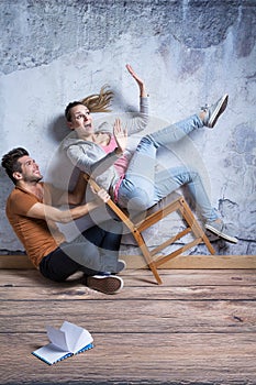 Woman on toppling chair photo