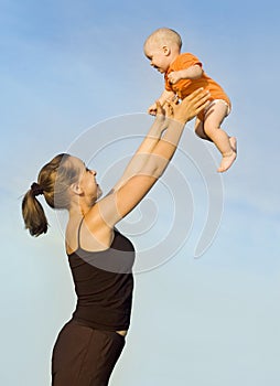 A woman tosses a child