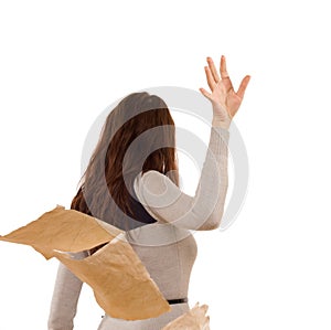 Woman tossing aside papers in anger