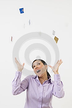 Woman Tossing Credit Cards In The Air