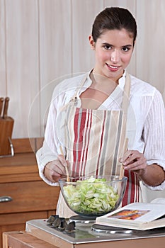 Woman tossing a salad