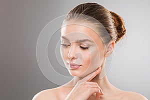 Woman touch own face