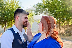 Woman touches man smiling