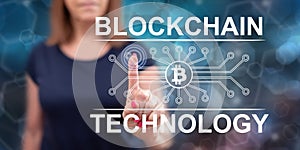 Woman touching a blockchain technology concept