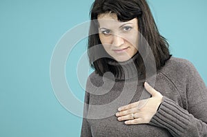 Woman touching breast