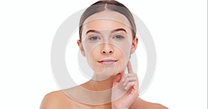 Woman touching face, beauty and skin with clean skincare and natural cosmetics isolated on white background. Female