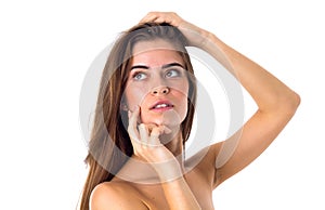 Woman touching face and holding hair
