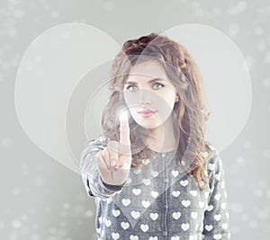 Woman touching heart symbol virtual display