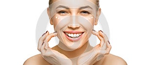 Woman touching her face by hands. Applying cream on a perfect smooth soft skin.