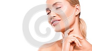 Woman touching her face on white background. Close up portrait.