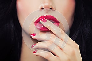 Woman Touching her Lips her Hand with Manicure