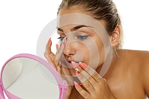 Woman touching her nose