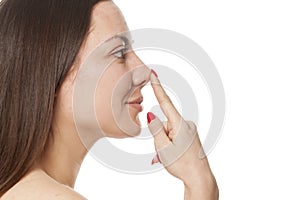 Woman touching her nose