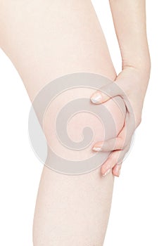 Woman touching her painful kneecap on white, clipping path