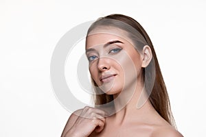 woman touching her shoulder and enjoying perfect soft clean skin