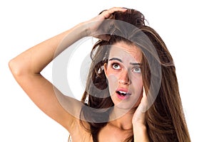 Woman touching her tangled hair