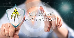 Woman touching a malware protection concept