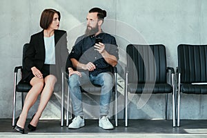 Woman touch man knee work harassment seduction photo