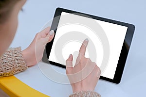 Woman touching white blank display of digital tablet - mockup image