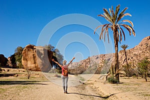 Woman tourist with arms outstretched in Morocco