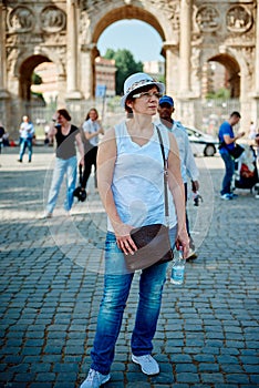 Woman tourist on the background of arch of Constantine