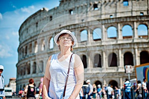 Woman tourist on the background of the Colosseum in Rome