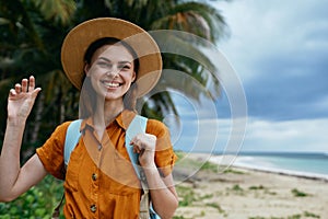 Woman tourist backpack hat smile island travel landscape