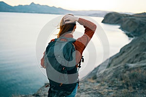 woman tourist backpack in the mountains active leisure travel nature