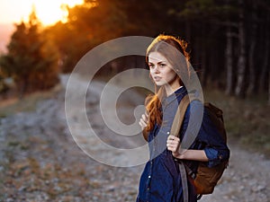 woman tourist with backpack on nature travel adventure vacation