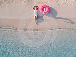 Woman tourist on the beach, top view.