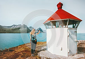 Woman tourist blogging with smartphone taking photo