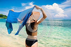 Woman tourist at tropical beach on vacation