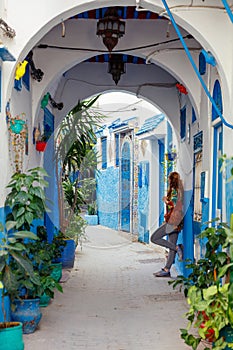 woman tourist in the blue street in Tanger