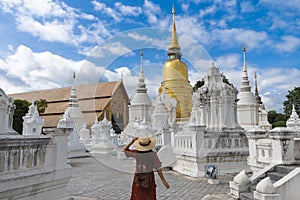 A woman tourist is enjoy sightseeing inside Wat Suan Dok in Chiangmai