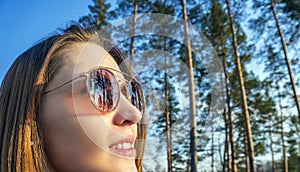 Woman tourist enjoying fresh air in the woods photo