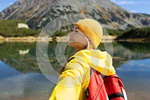 Woman tourist enjoying lake view alone outdoors Travel adventure in active