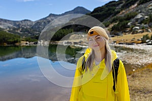 Woman tourist enjoying lake view alone outdoors Travel adventure in active