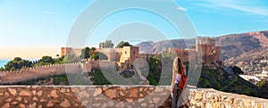 Woman tourist enjoying panorama view of Alcazaba,  Almeria