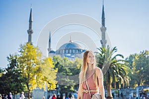 Woman tourist enjoying the view Blue Mosque, Sultanahmet Camii, Istanbul, Turkey