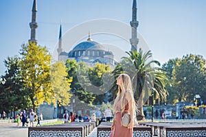 Woman tourist enjoying the view Blue Mosque, Sultanahmet Camii, Istanbul, Turkey