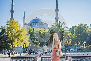 Woman tourist enjoying the view Blue Mosque, Sultanahmet Camii, Istanbul, Turkey